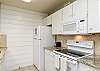 Fully equipped kitchen with ample counter space and storage 