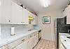 Fully equipped kitchen ample storage and counter space 