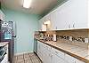 Fully equipped kitchen area with 12 cup coffee maker 