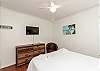 Updated master bedroom with queen size bed, private bathroom, and flat screen TV