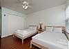 Guest bedroom with two queen size beds and flat screen TV
