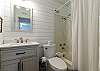 Guest bathroom with tub and shower