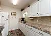 Remodeled kitchen with beautiful counter tops and plenty of storage 
