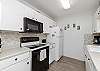 Fully equipped kitchen with ample storage and counter space 