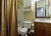 Full bathroom with tub and shower 