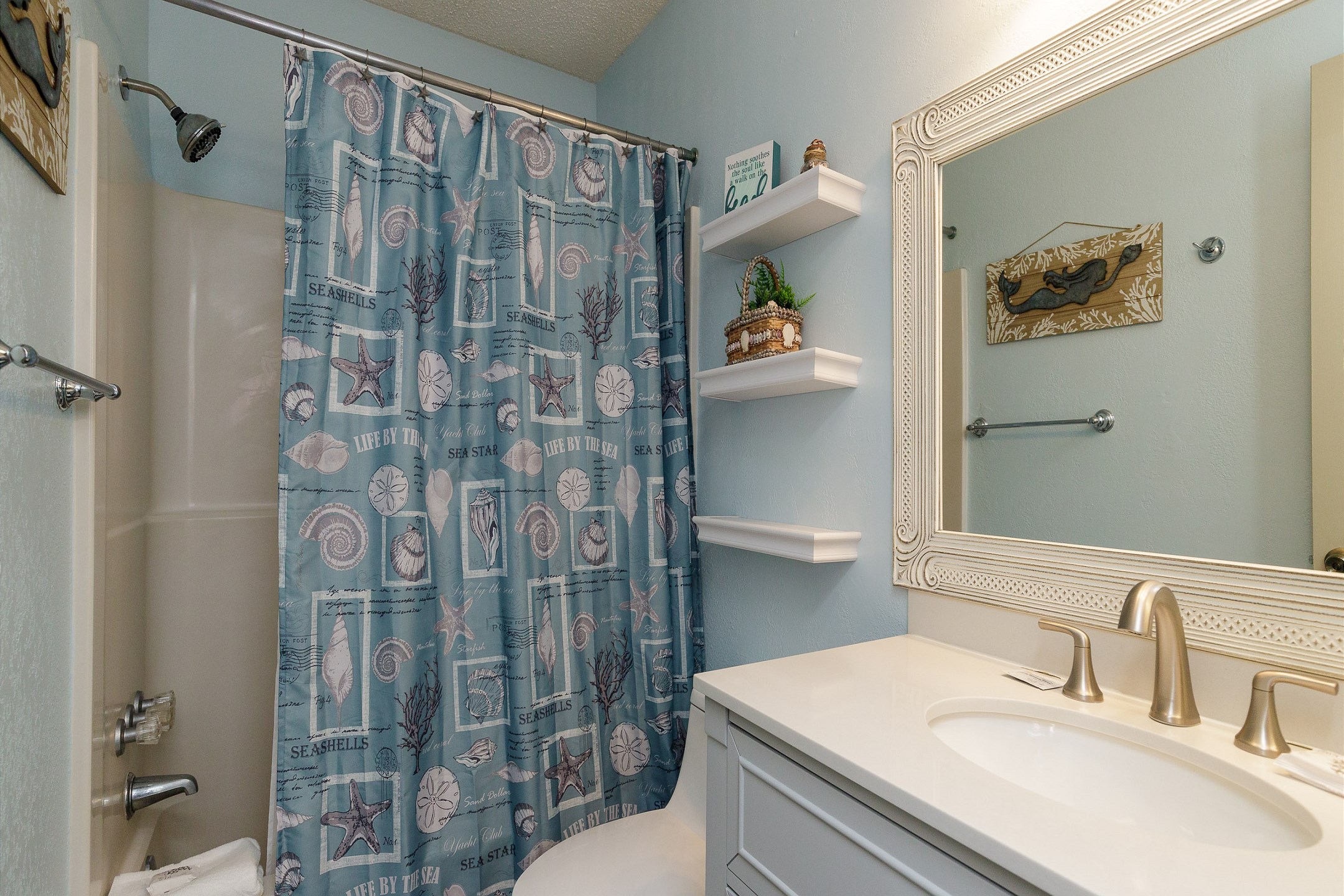 Guest bathroom on the second floor with tub and shower combo