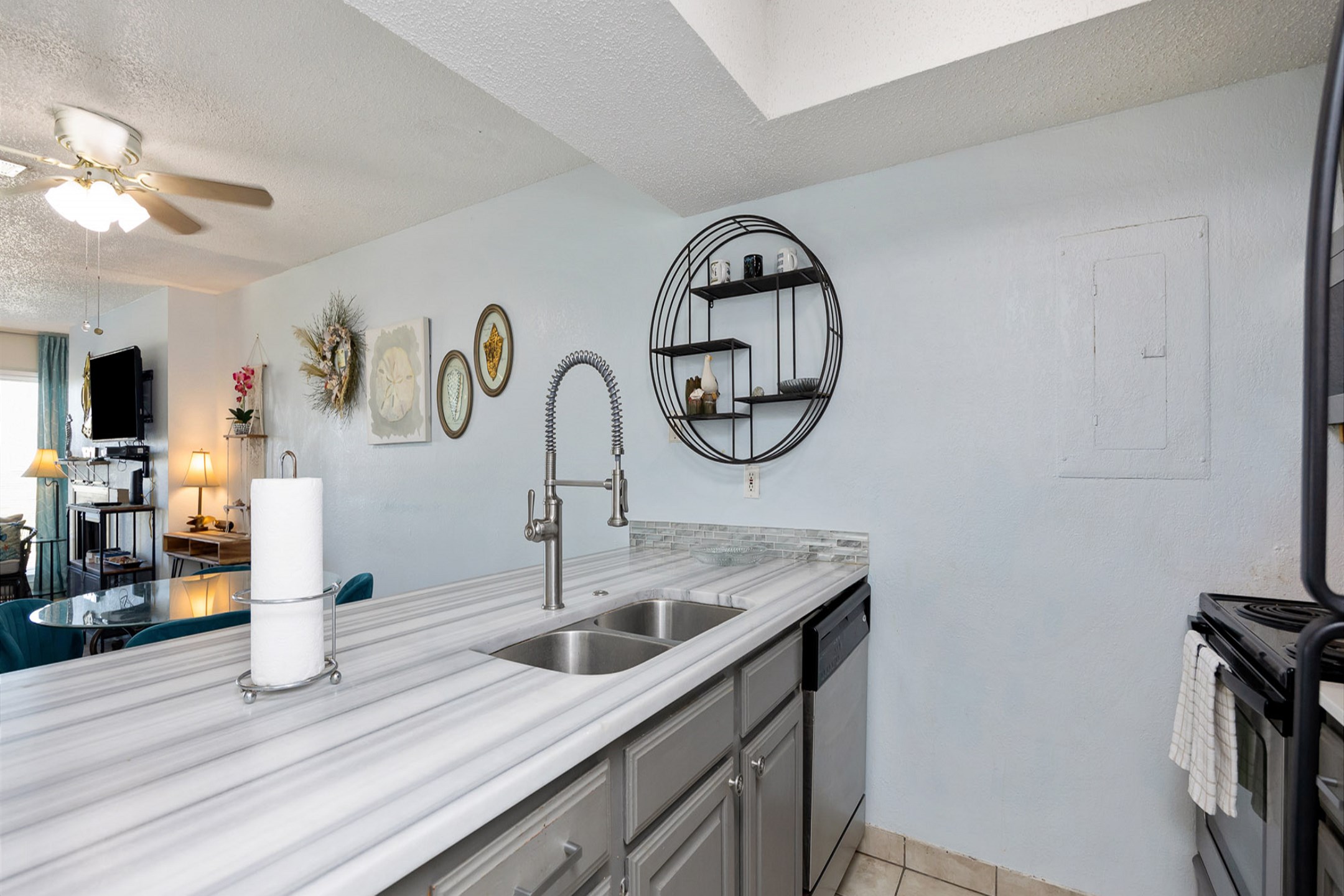 Well-appointed modern kitchen with beautiful granite countertops and generous space for cooking and serving