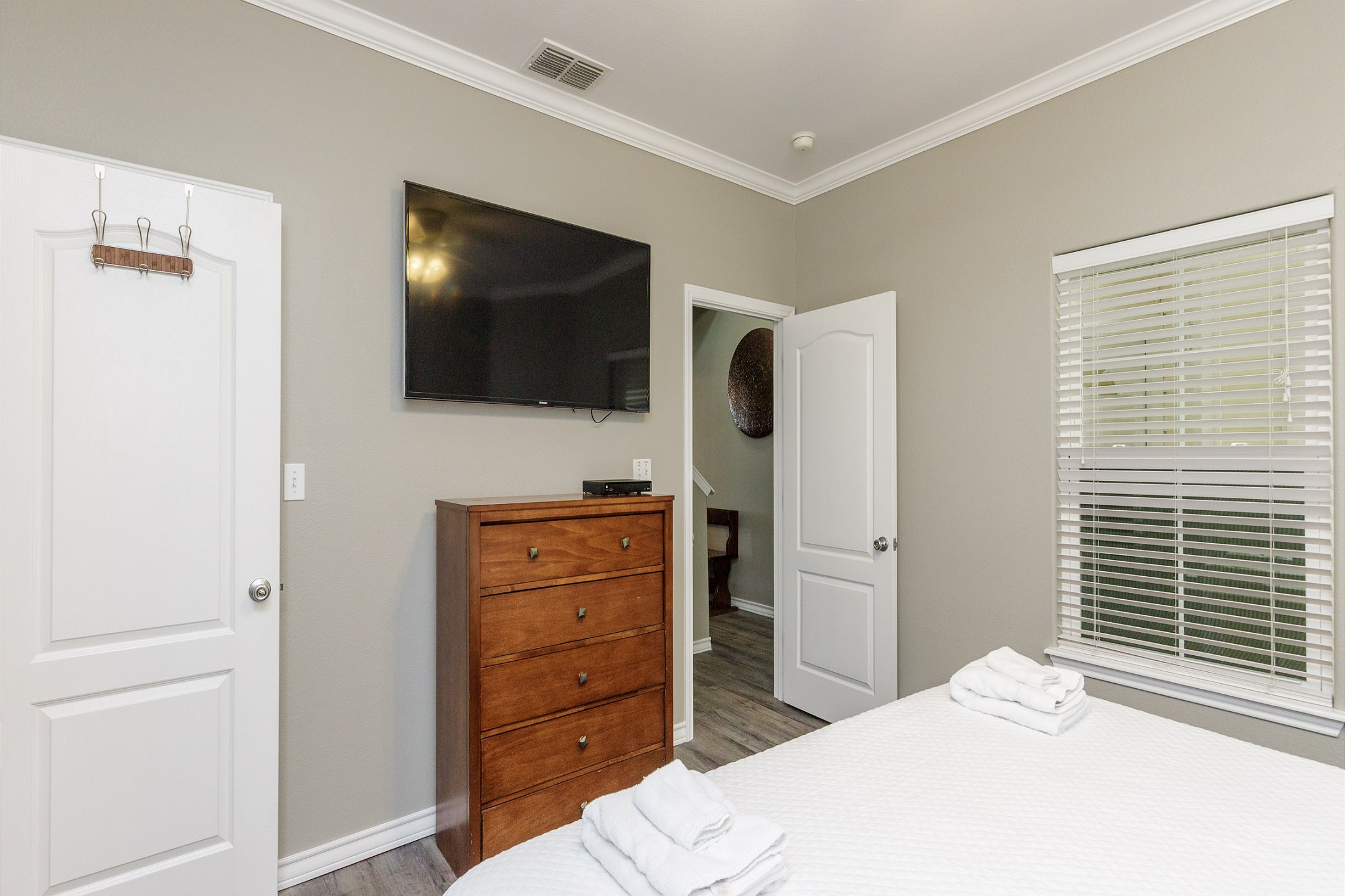 Master bedroom on the first floor with king size bed, private bathroom and flat screen TV