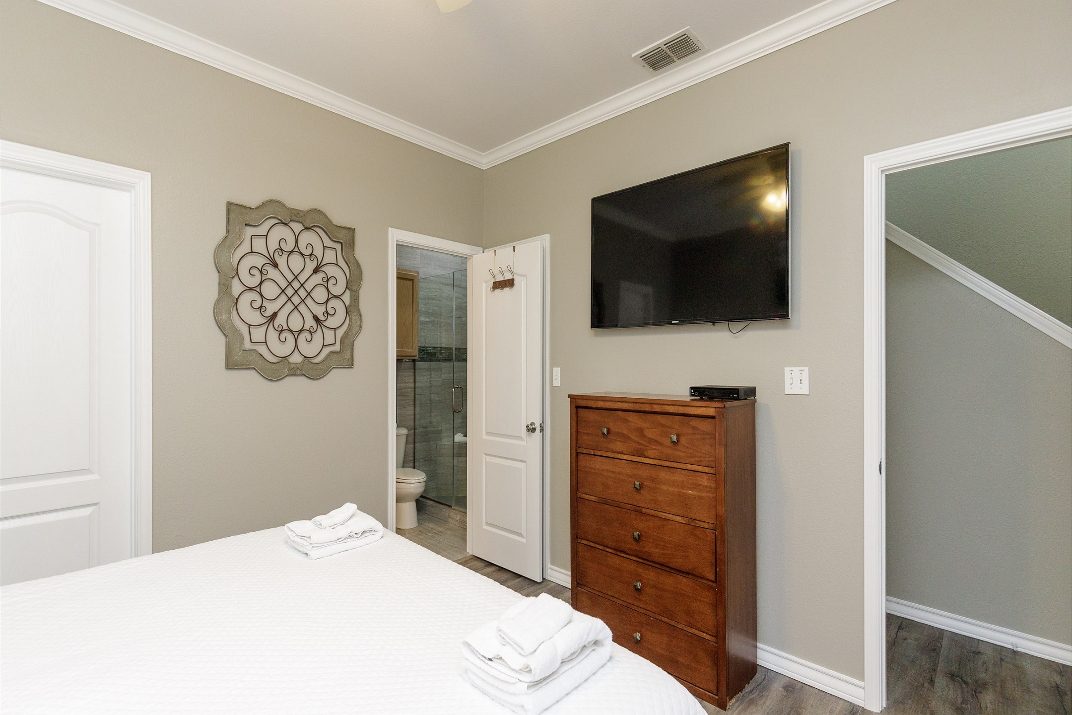 Master bedroom on the first floor with king size bed, private bathroom and flat screen TV