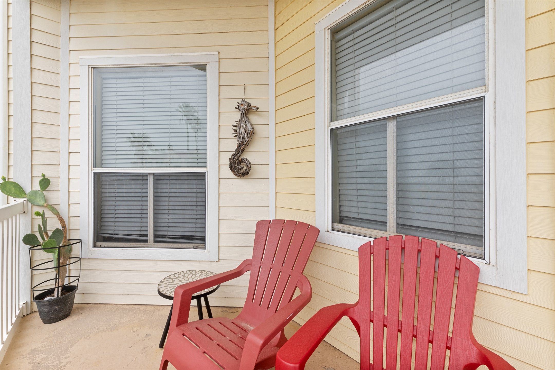 Relax on your private patio with views of the pool and pond