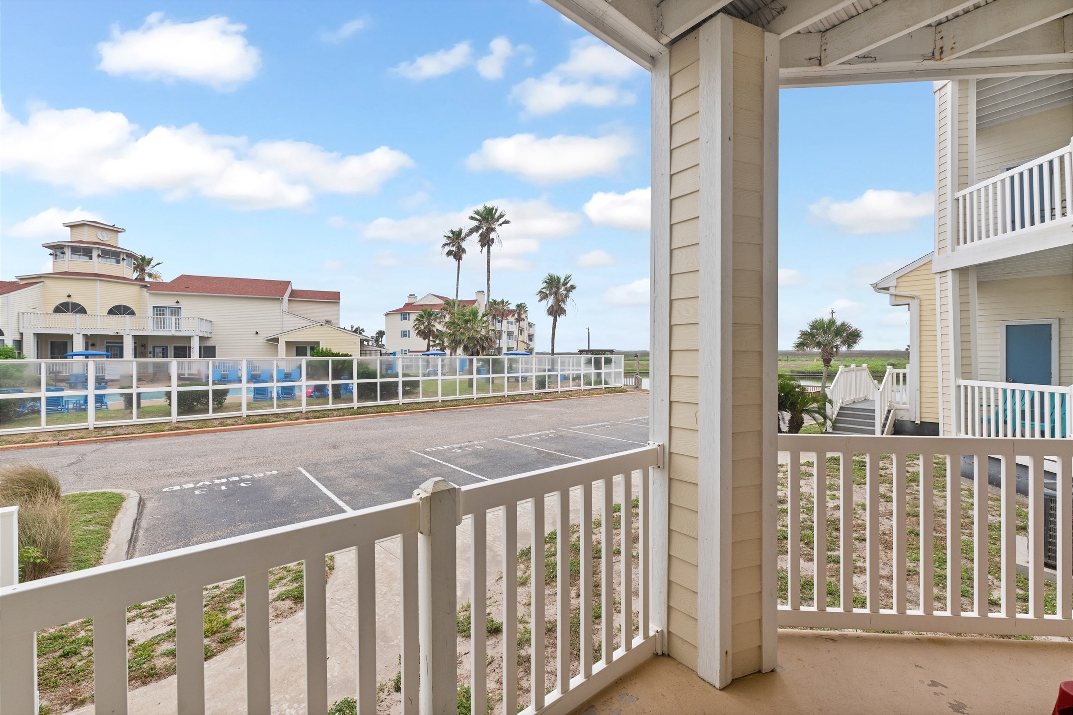 Covered patio with pool view, perfect for relaxing anytime of day