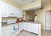 Fully equipped kitchen with updated appliances that over looks the living space