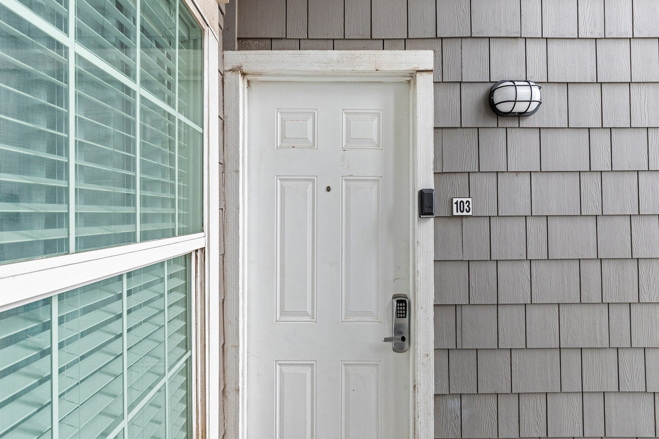 Front entrance, condo 103 on the first floor - coded lock for extra security which includes contact-less check in