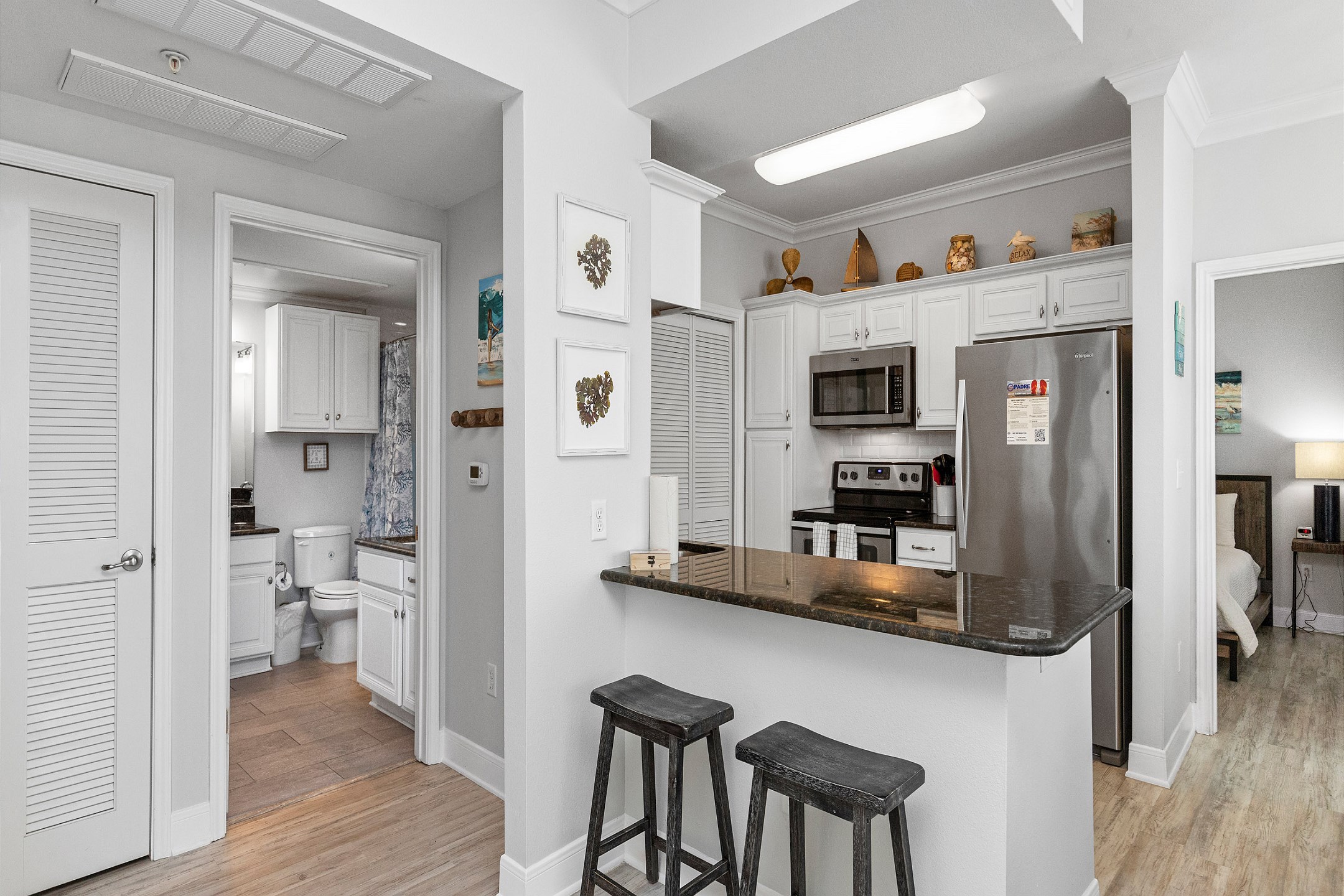 Open concept kitchen area with breakfast bar