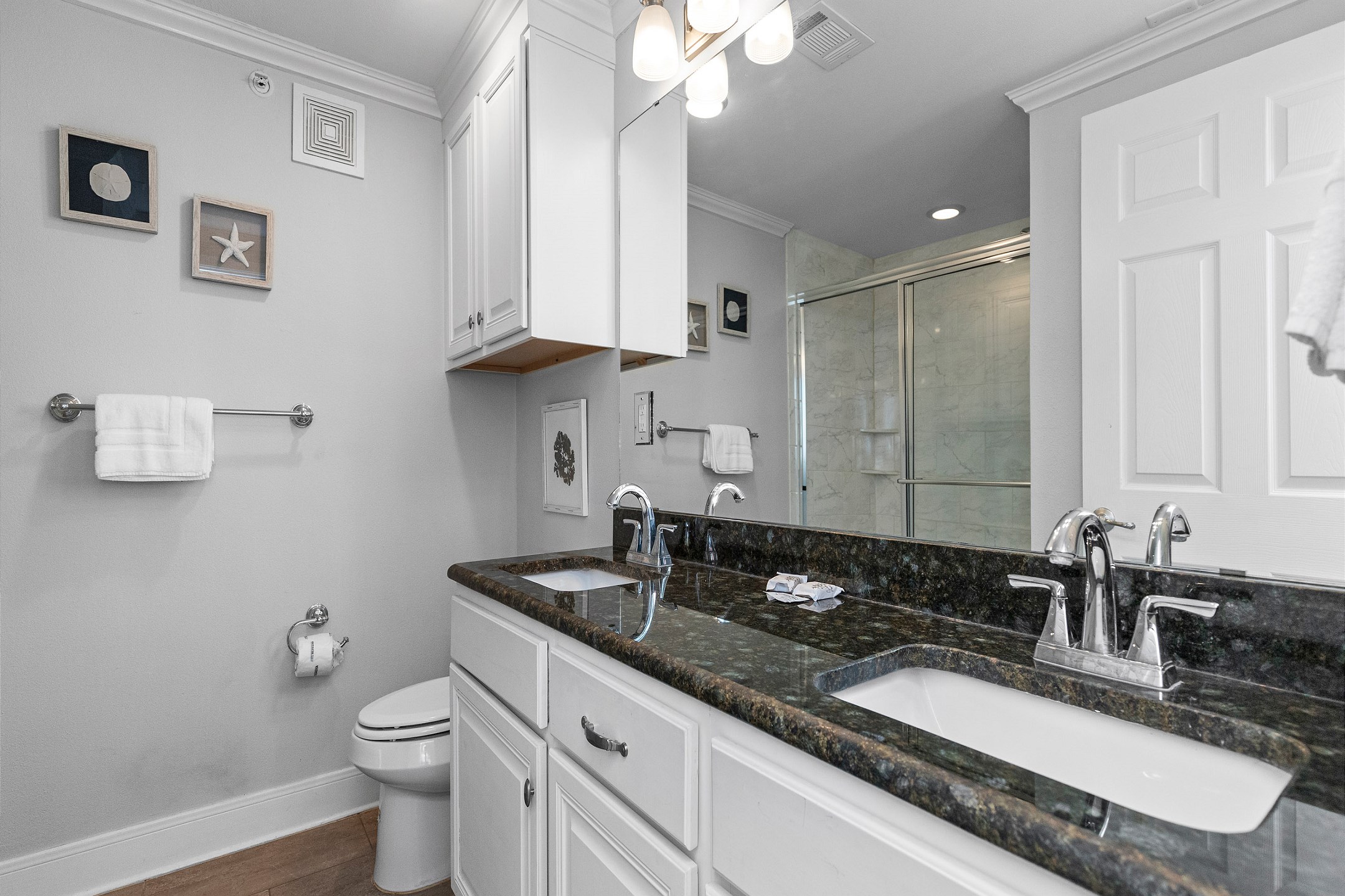 Master bathroom with double sinks and walk in shower 