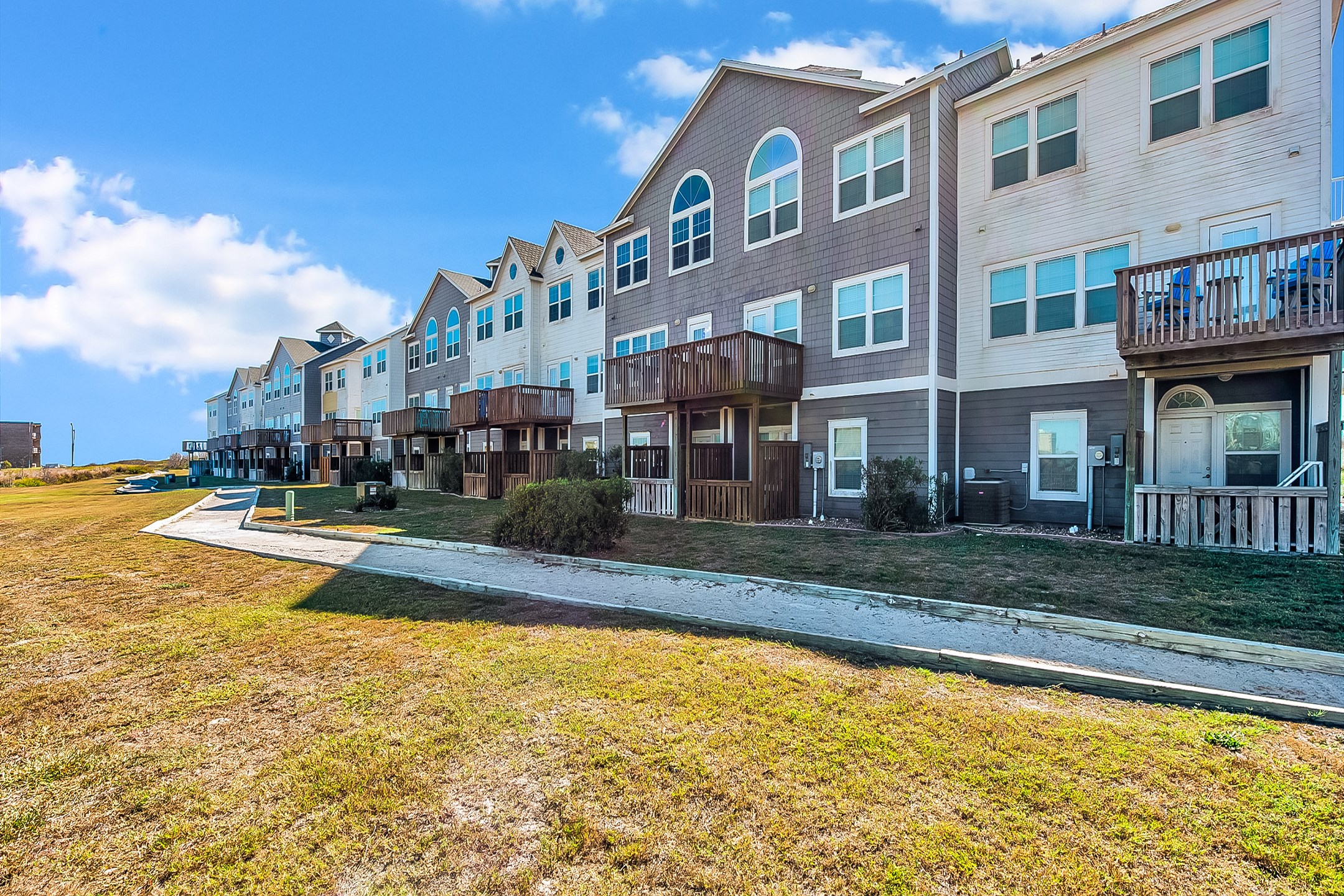 A convenient, private walkway to the beach behind the condos