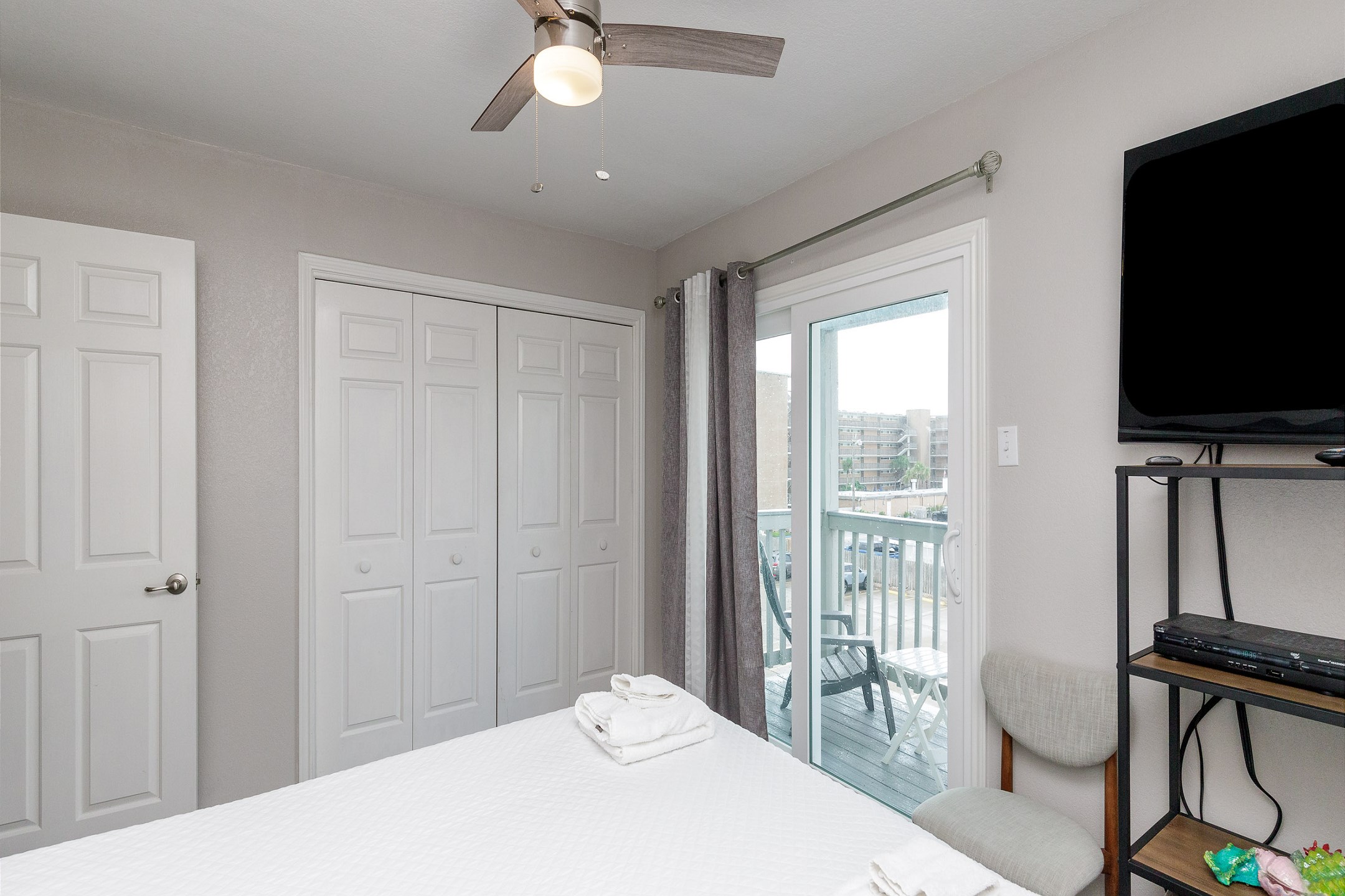 Second bedroom on the second floor with queen size bed, private balcony and flat screen TV