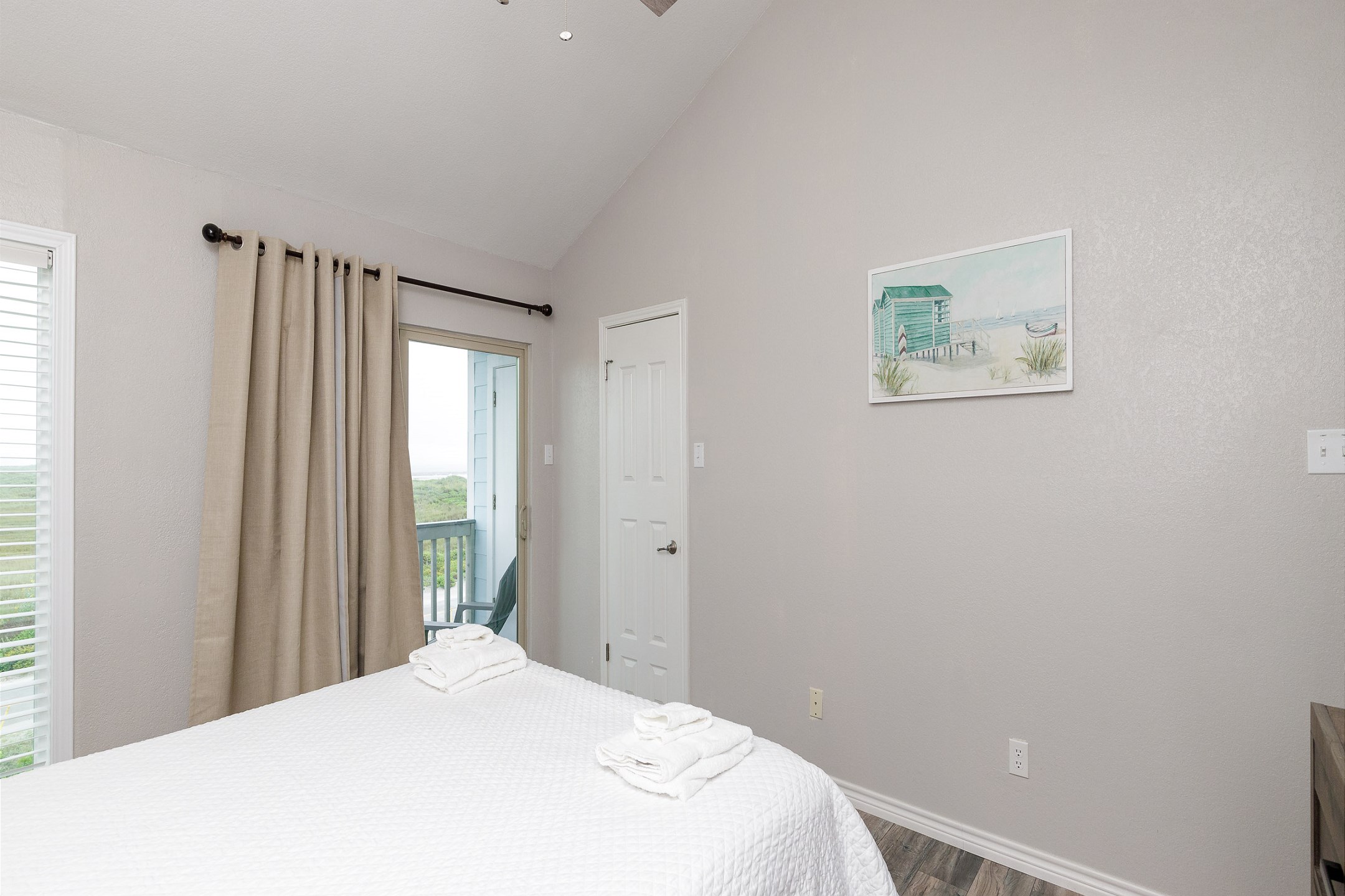 Master bedroom on the second floor with queen size bed, ensuite bathroom, private balcony and flat screen TV