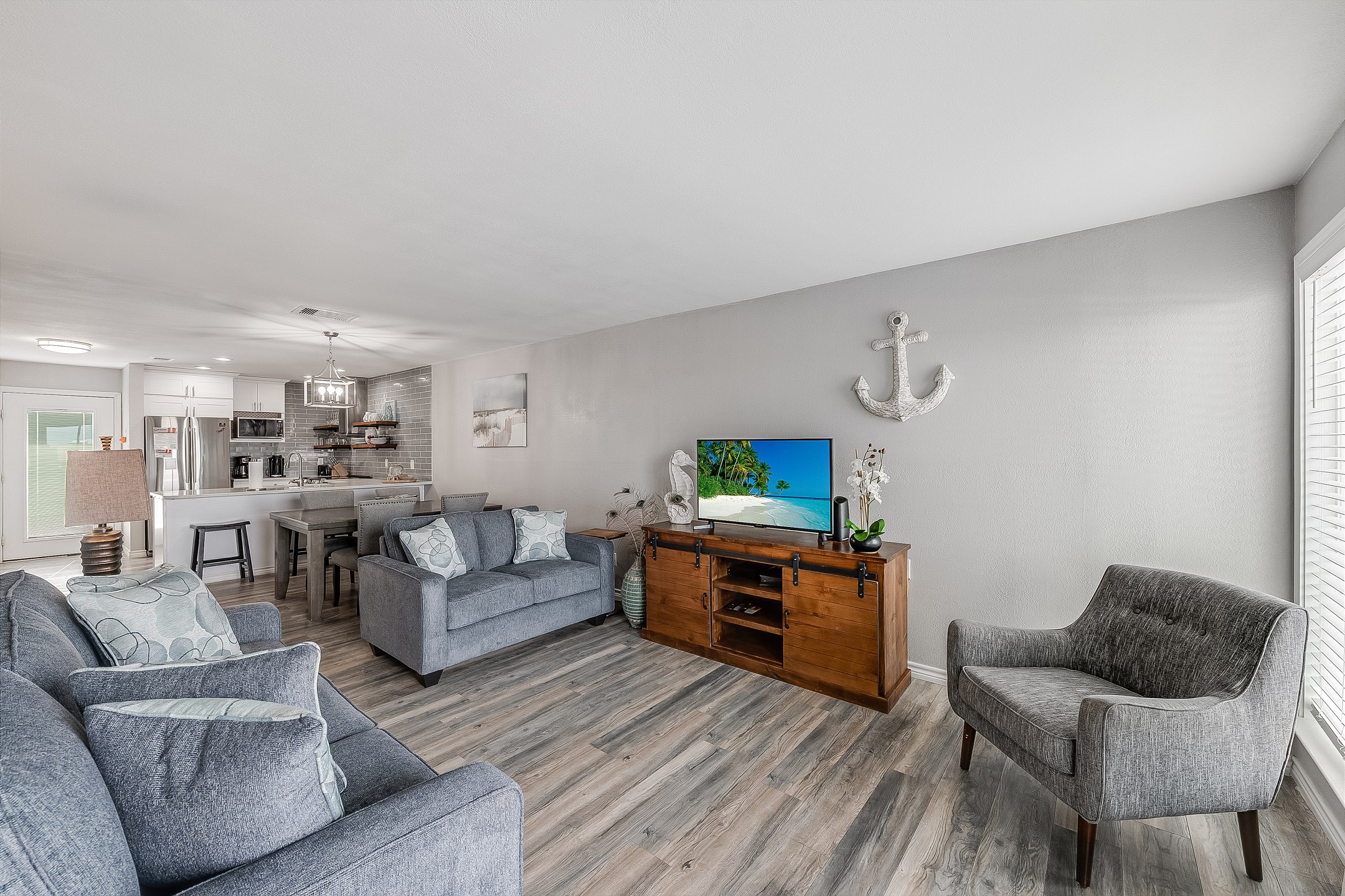 Cheerful living area featuring ample seating, perfect for family gatherings and relaxation