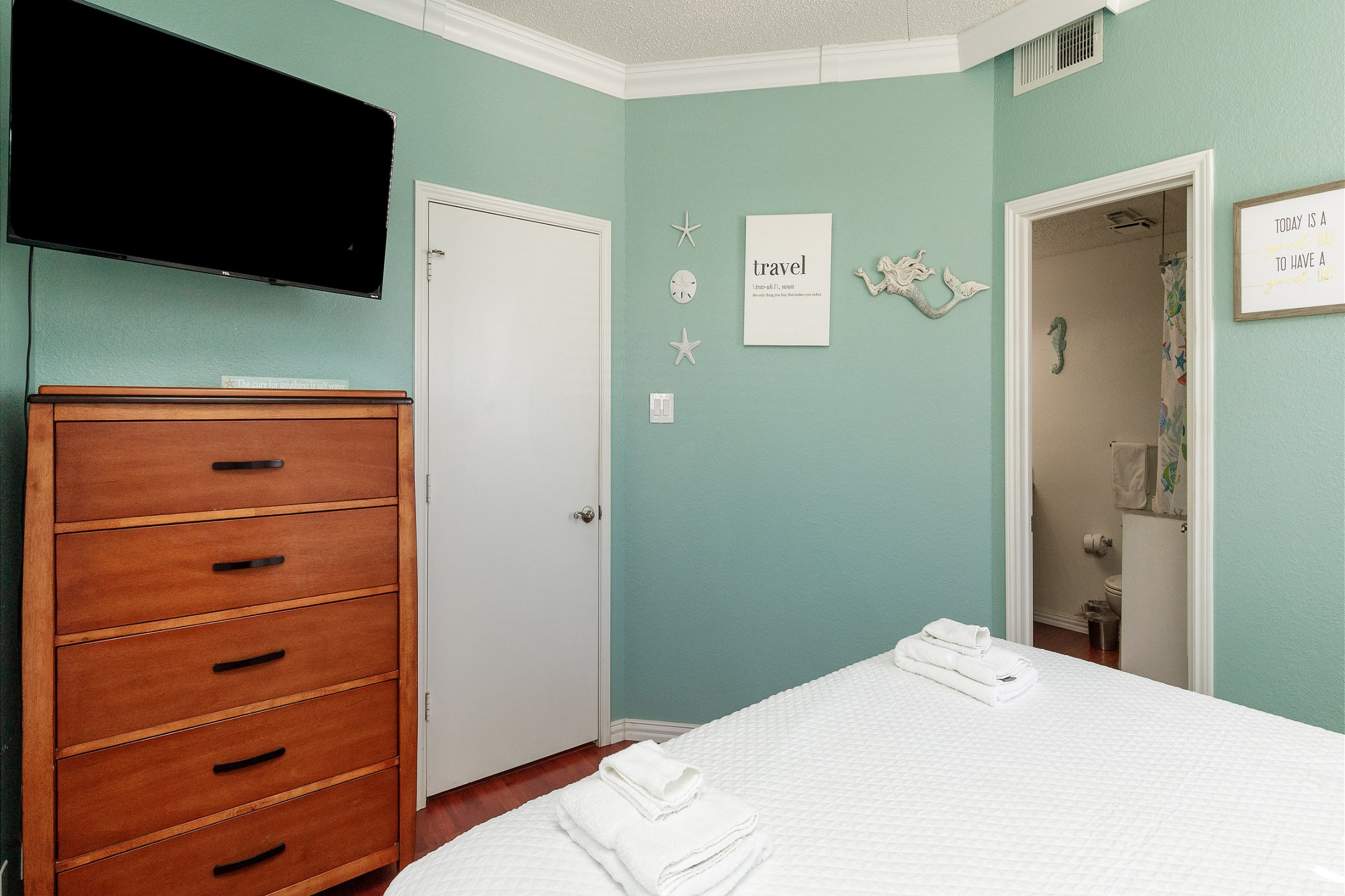 Master bedroom with king size bed and flat screen TV