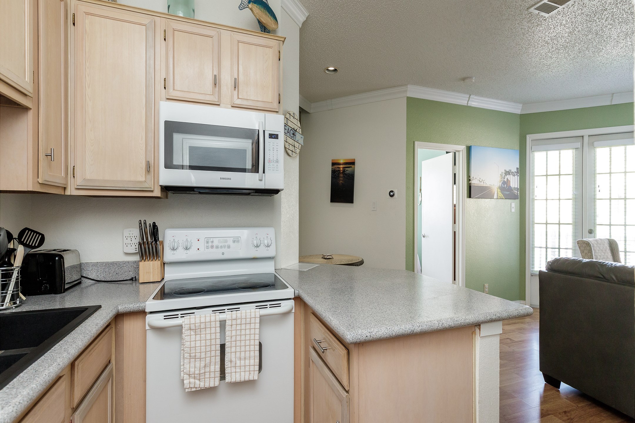 Take advantage of the breakfast bar that opens up into the living area 