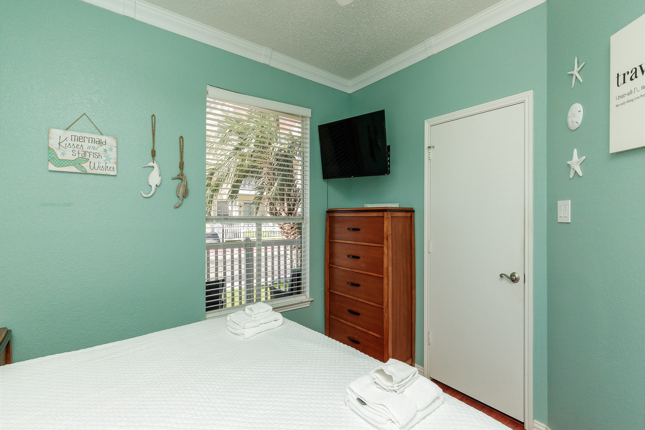 Master bedroom with king size bed and flat screen TV