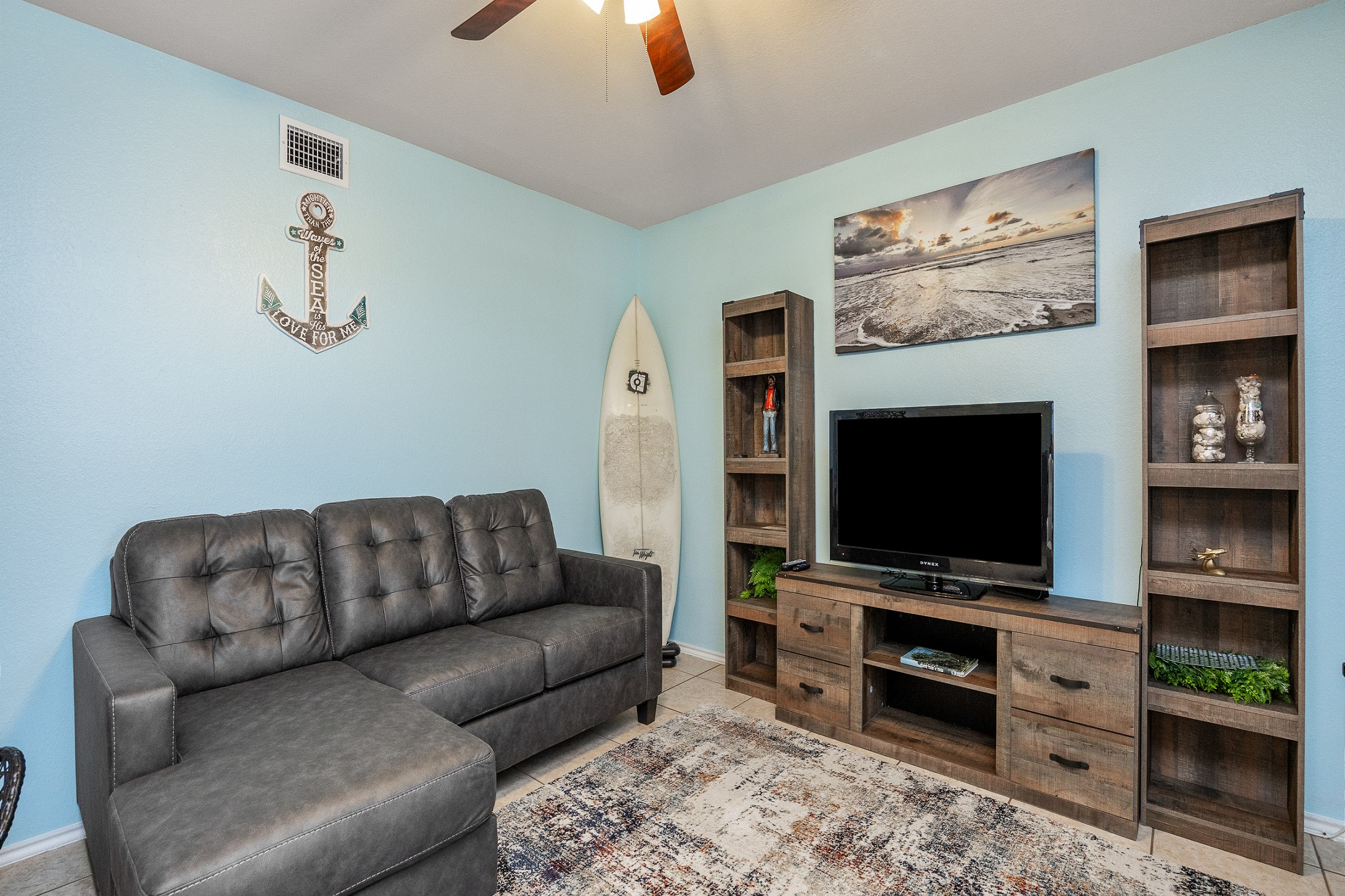 Newly updated living area with comfortable seating and flat screen TV 