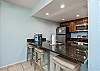 Newly updated kitchen with breakfast bar that seats three including both Keurig and full cup coffee pot maker. 