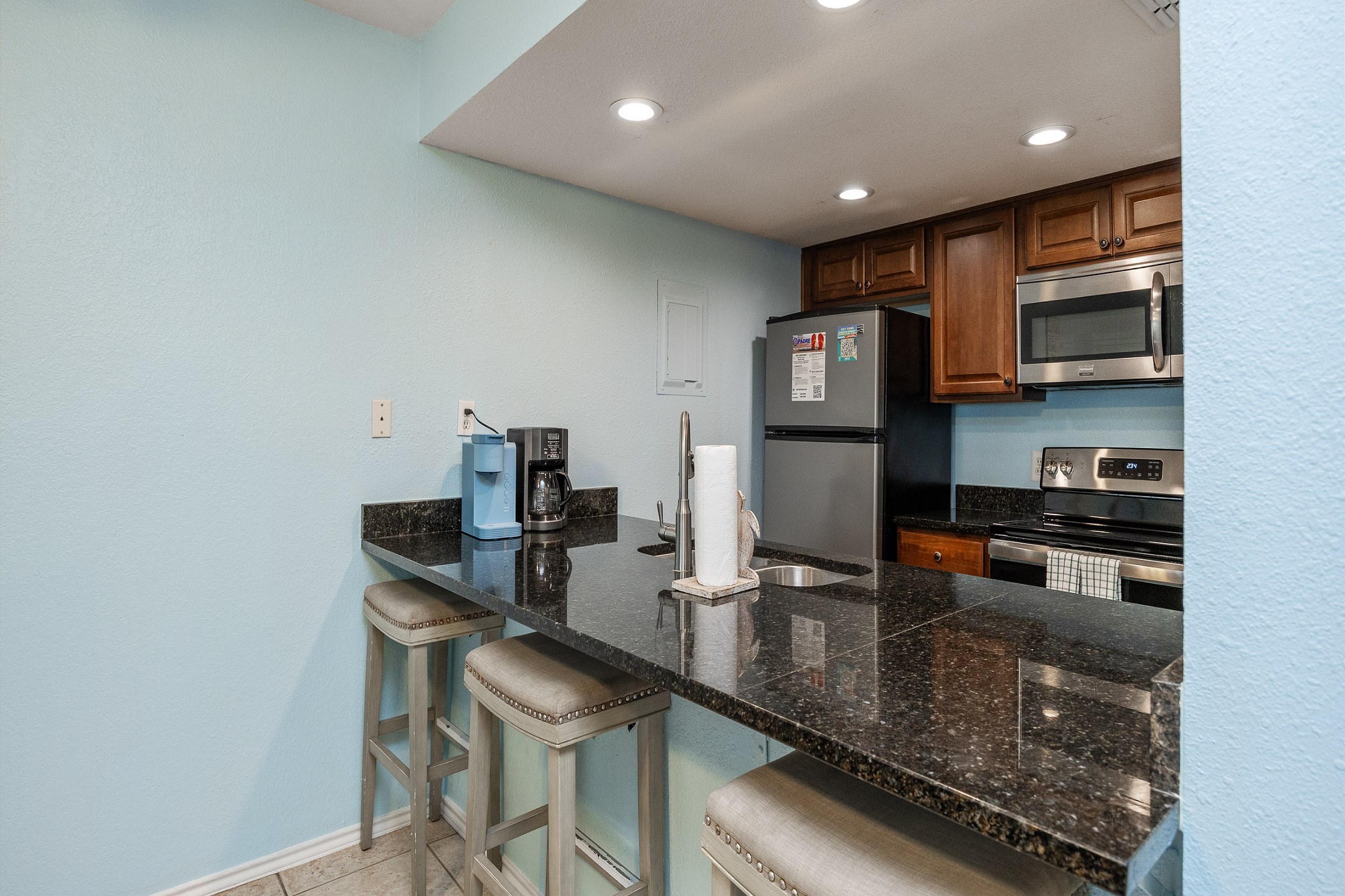 Newly updated kitchen with breakfast bar that seats three including both Keurig and full cup coffee pot maker. 