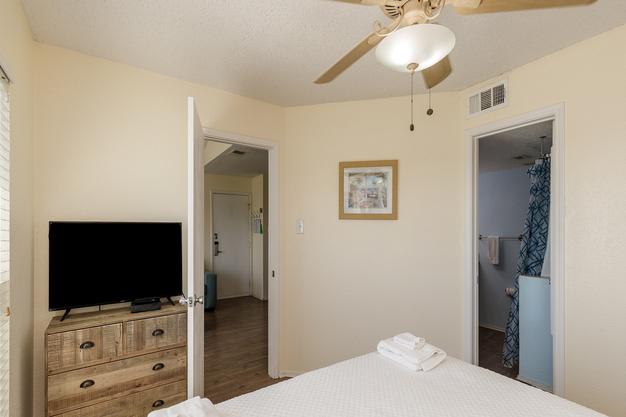 Master bedroom with king size bed and flat screen TV