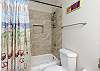 Master bathroom with tub and shower
