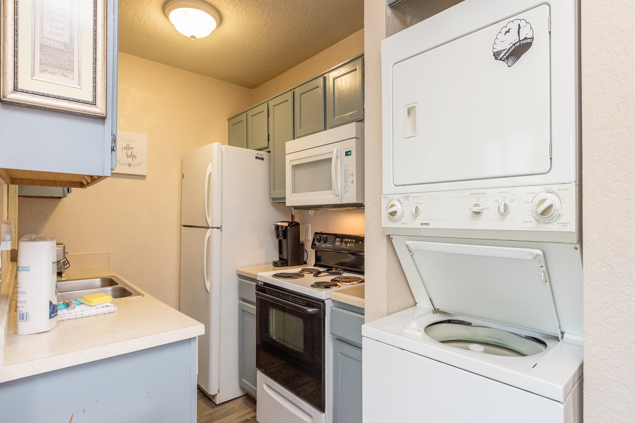 Stackable washer and dryer in property
