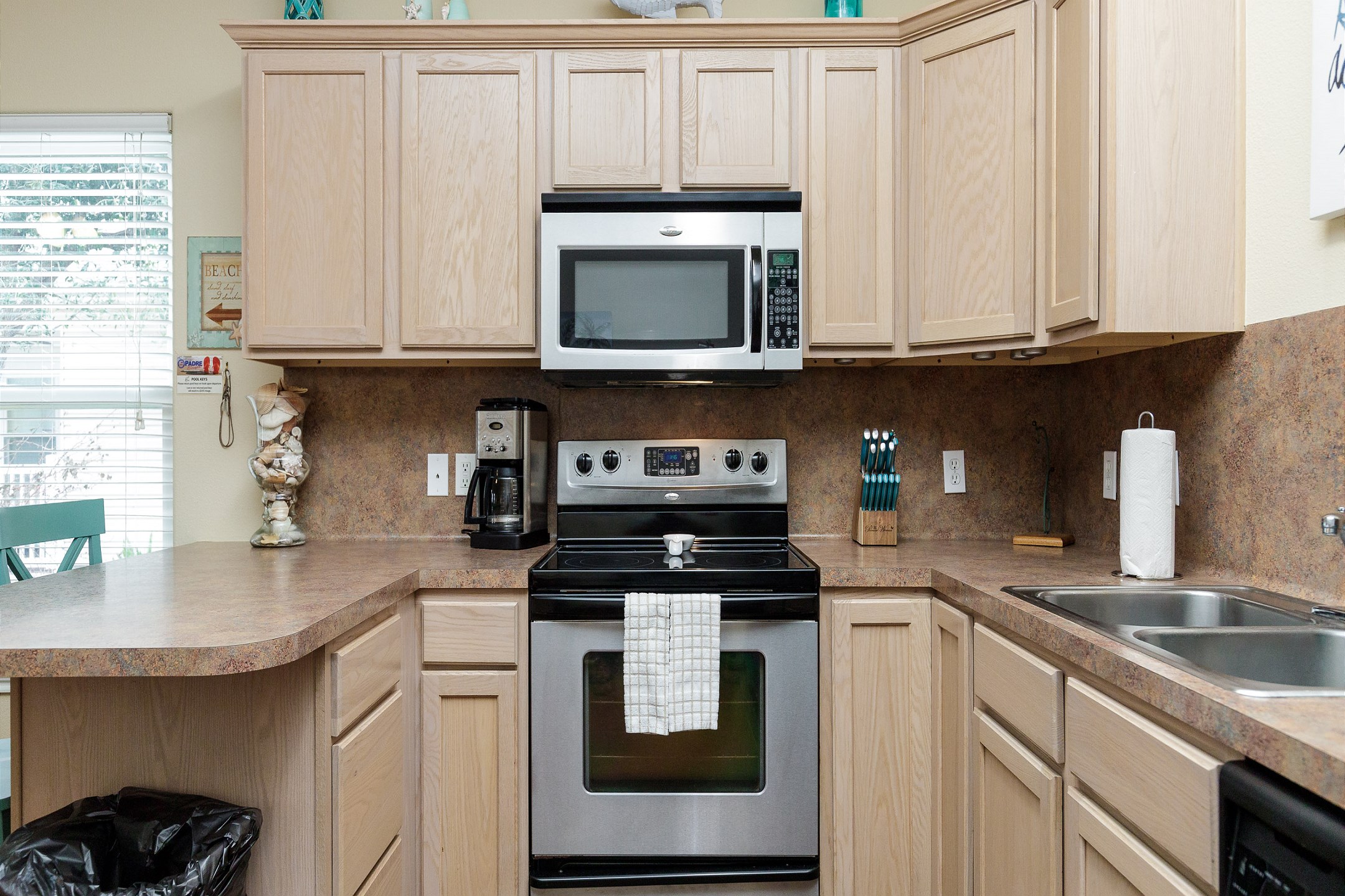 Well-equipped kitchen with stainless steel appliances and ample counter space to cook meals with the family 