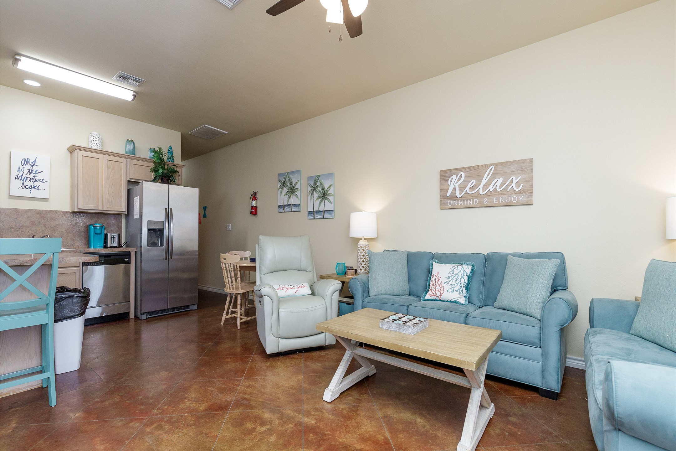 The kitchen, dining, and living areas blend together seamlessly for a bright and airy feel