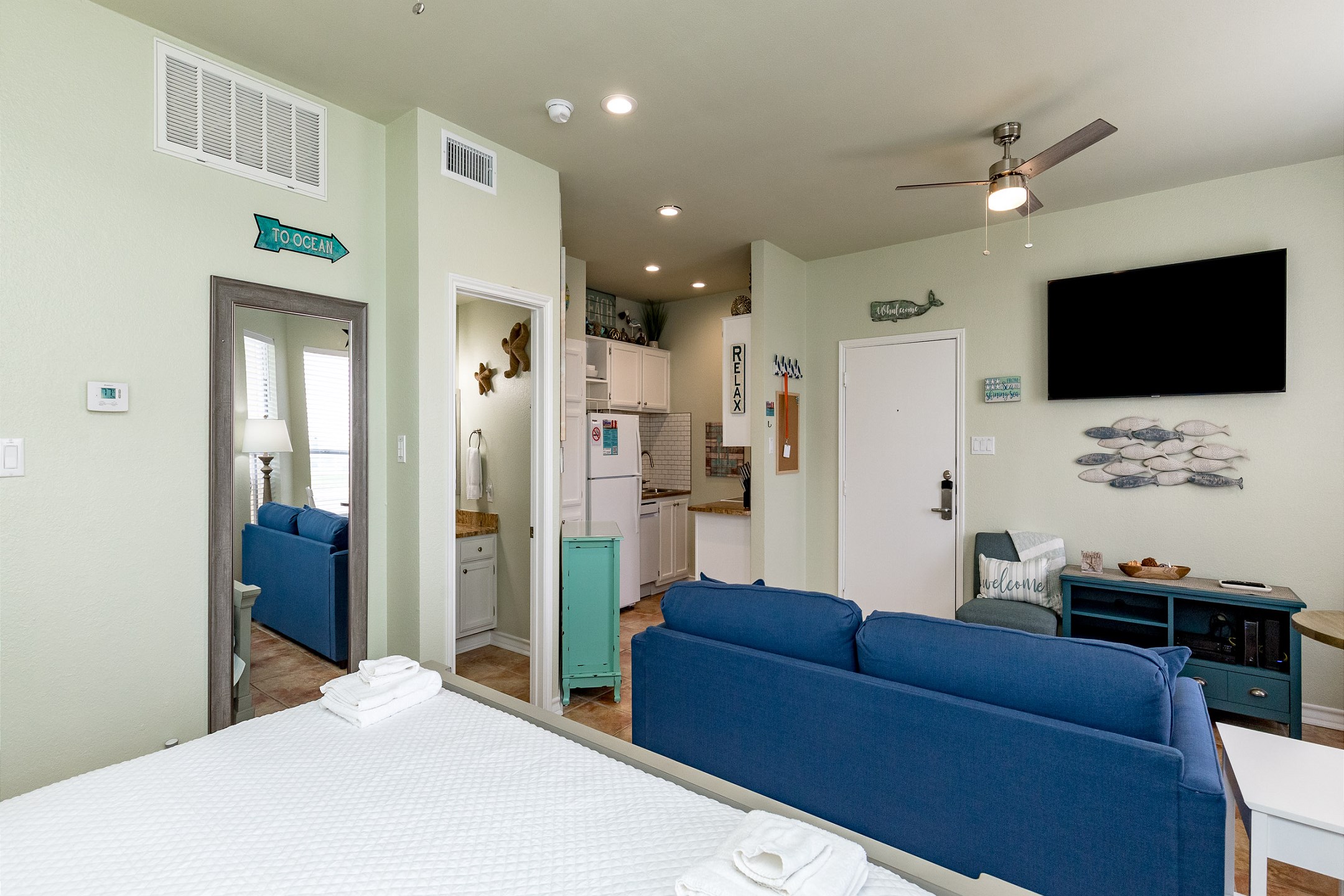 Enjoy the TV from the couch / queen sleeper sofa or king bed