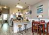 Open concept dining and kitchen area with seating for six