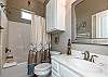 Guest bathroom on the second floor with tub and shower