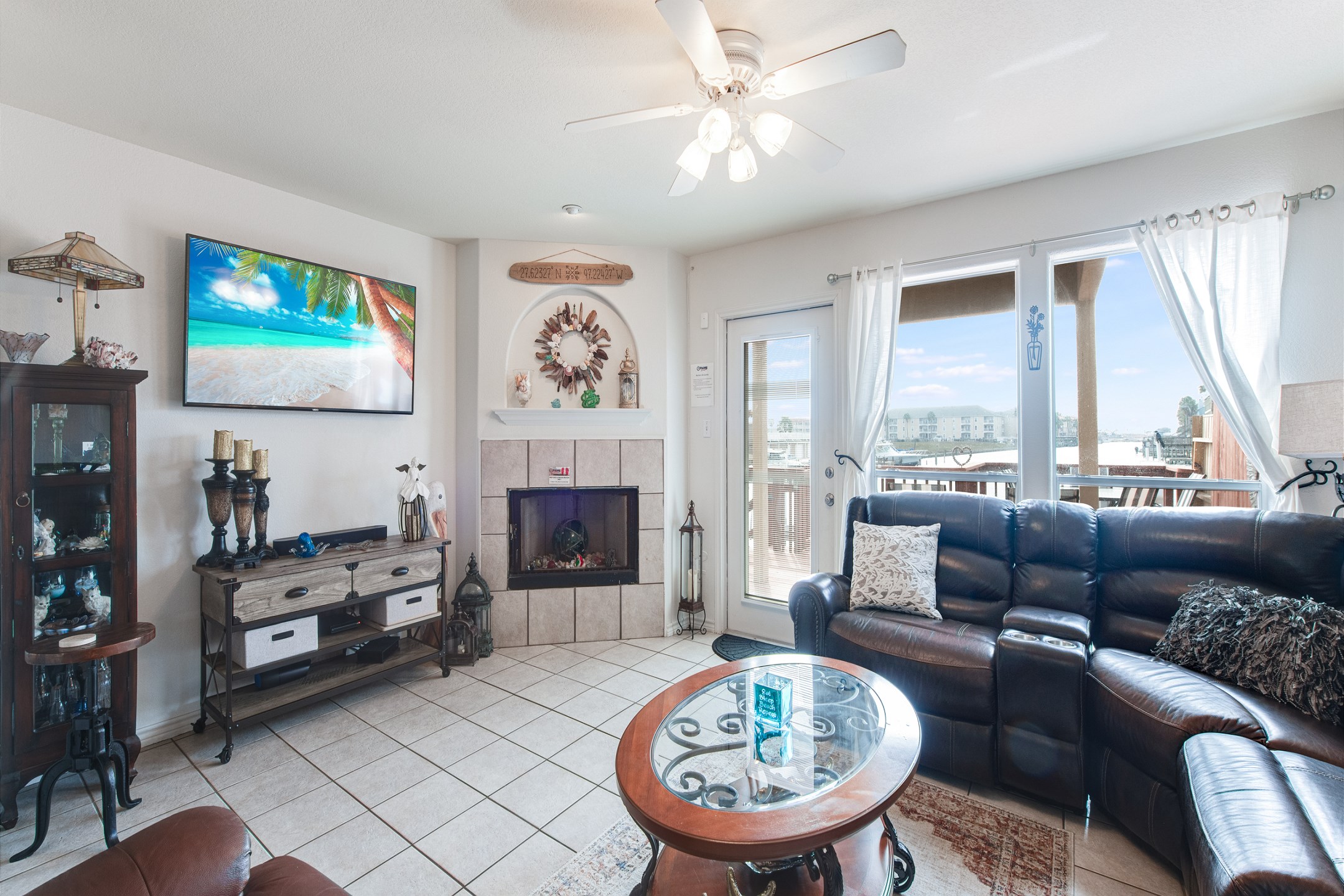 Cozy living space with large windows to allow the natural light to shine in and enjoy the views of the canal