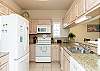 Fully equipped kitchen with ample storage and counter space 