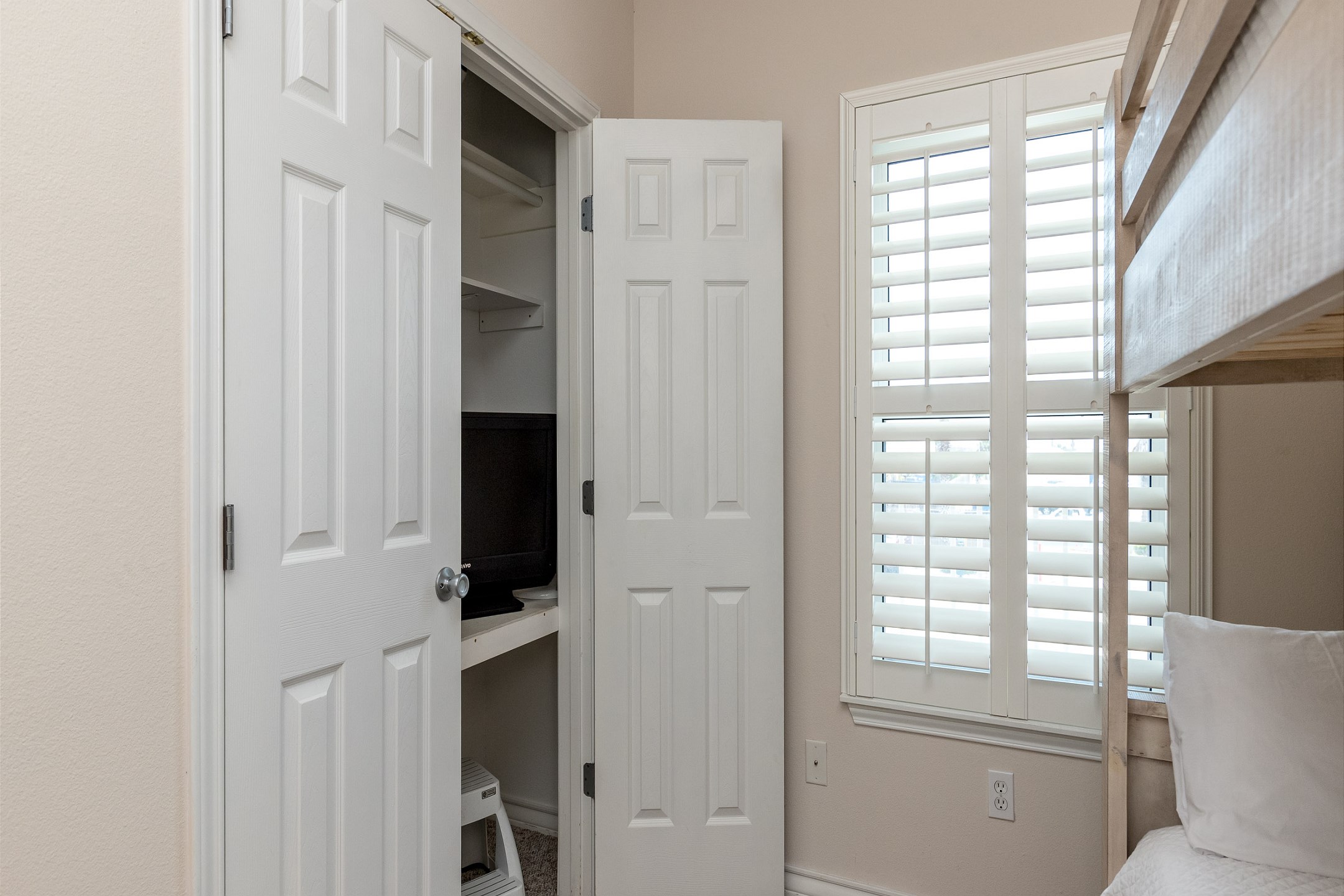 Third bedroom with full size bunk beds and closet