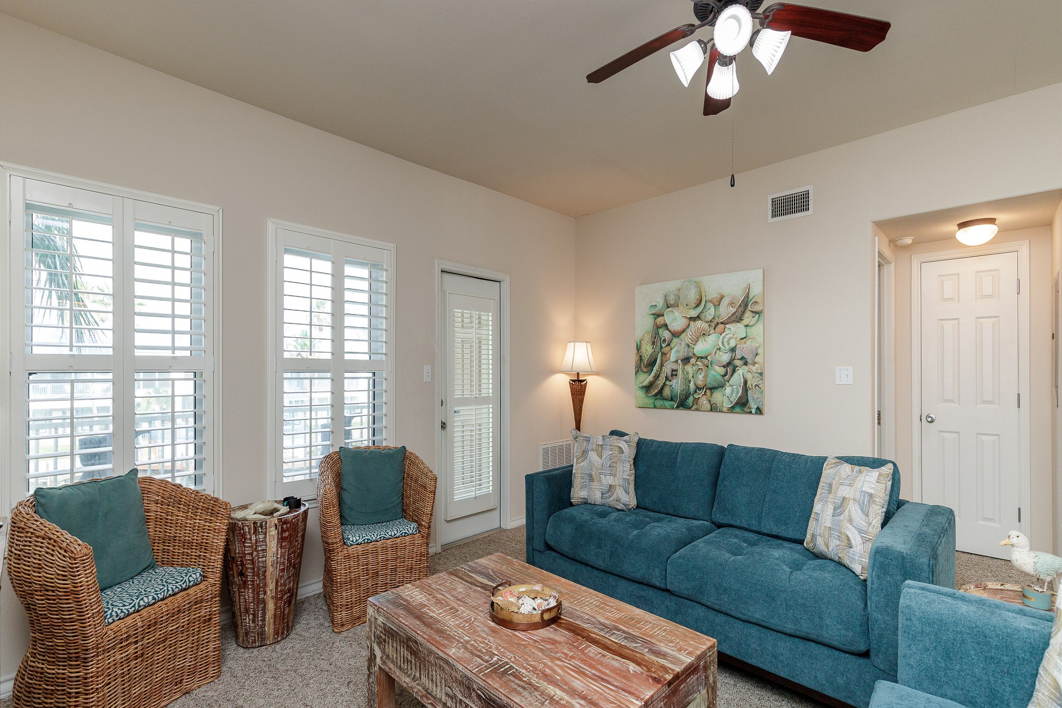 Plenty of comfy seating to relax with the family with waterfront balcony access 