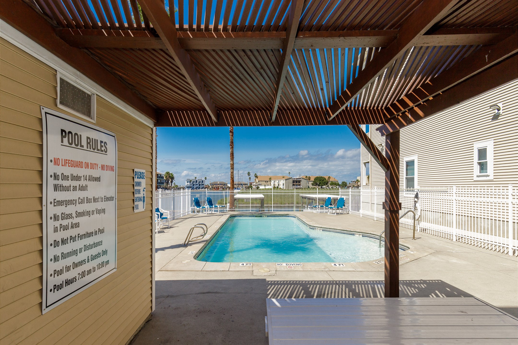 Gated pool area with picnic table