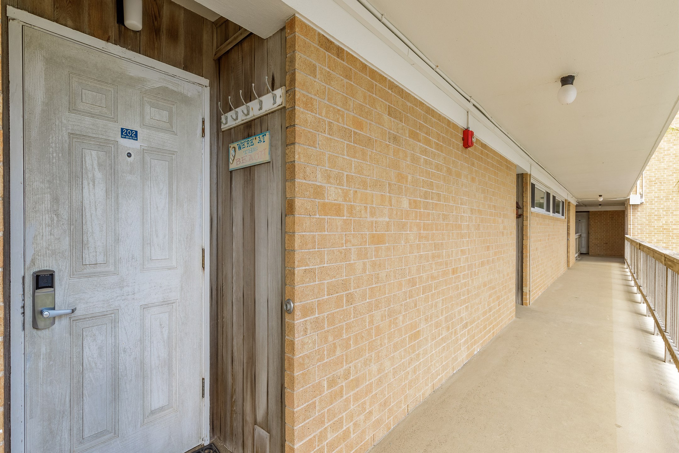 Front door to condo located on the 2nd floor. Complex has elevators available for guests