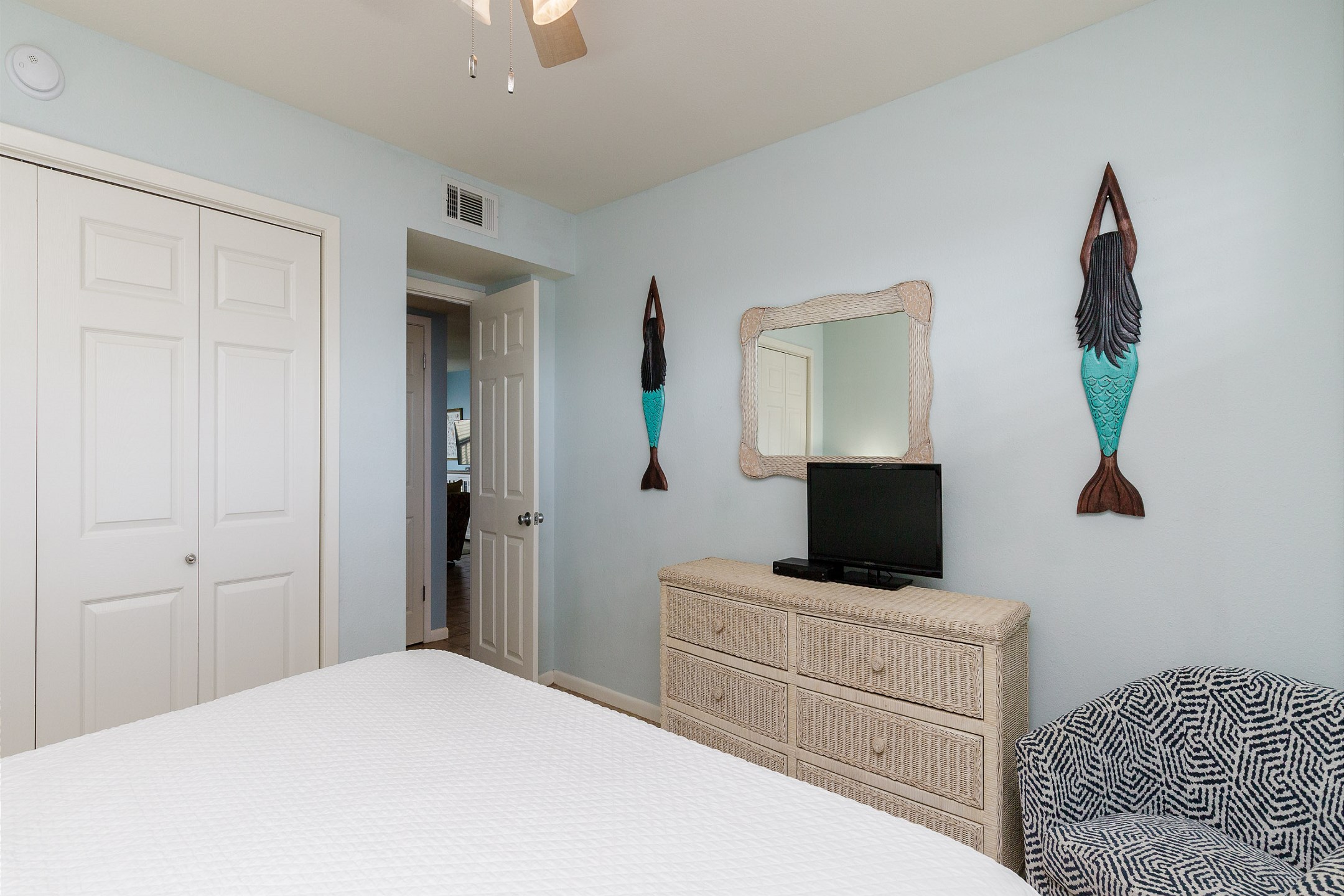 Master bedroom with a king size bed and a TV