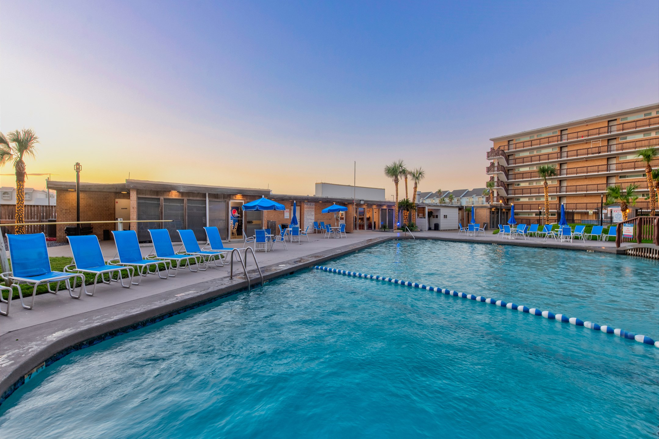 Experience a blissful coastal getaway at the heated pool with relaxing loungers