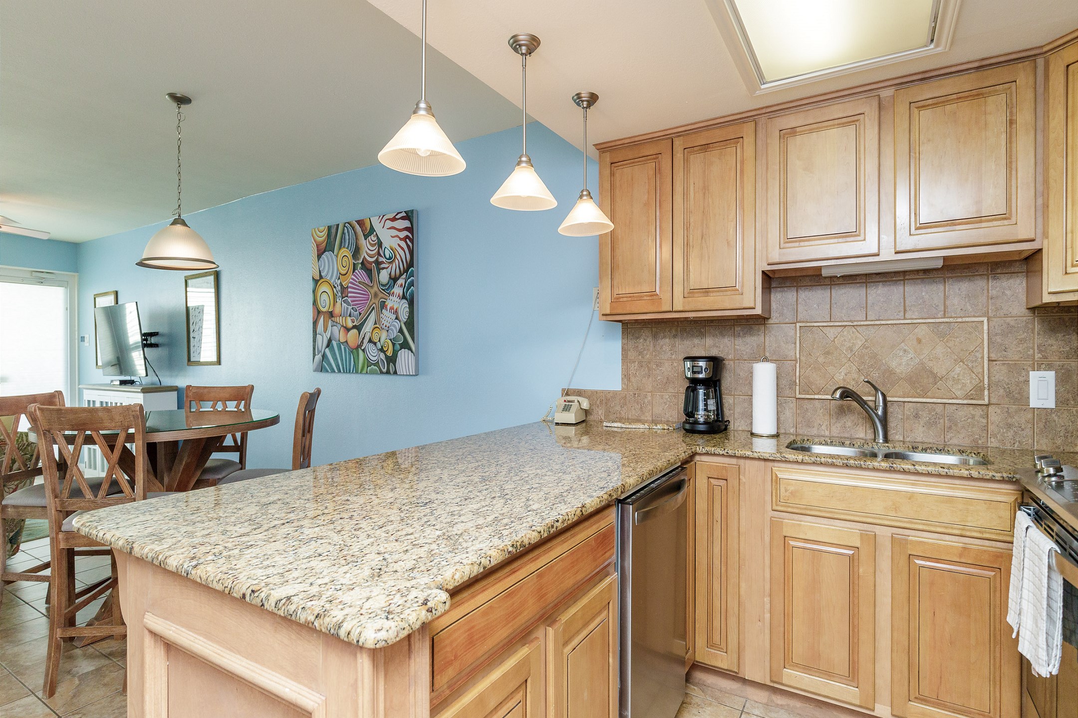 Coffee maker, toaster, cookware, dinnerware, and other kitchen essentials provided