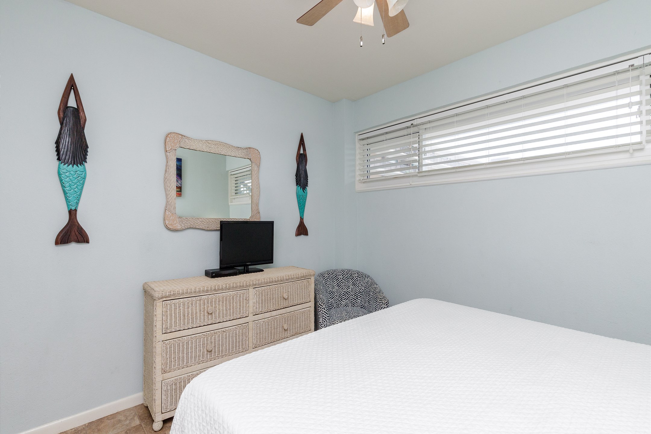Master bedroom with a king size bed and a TV