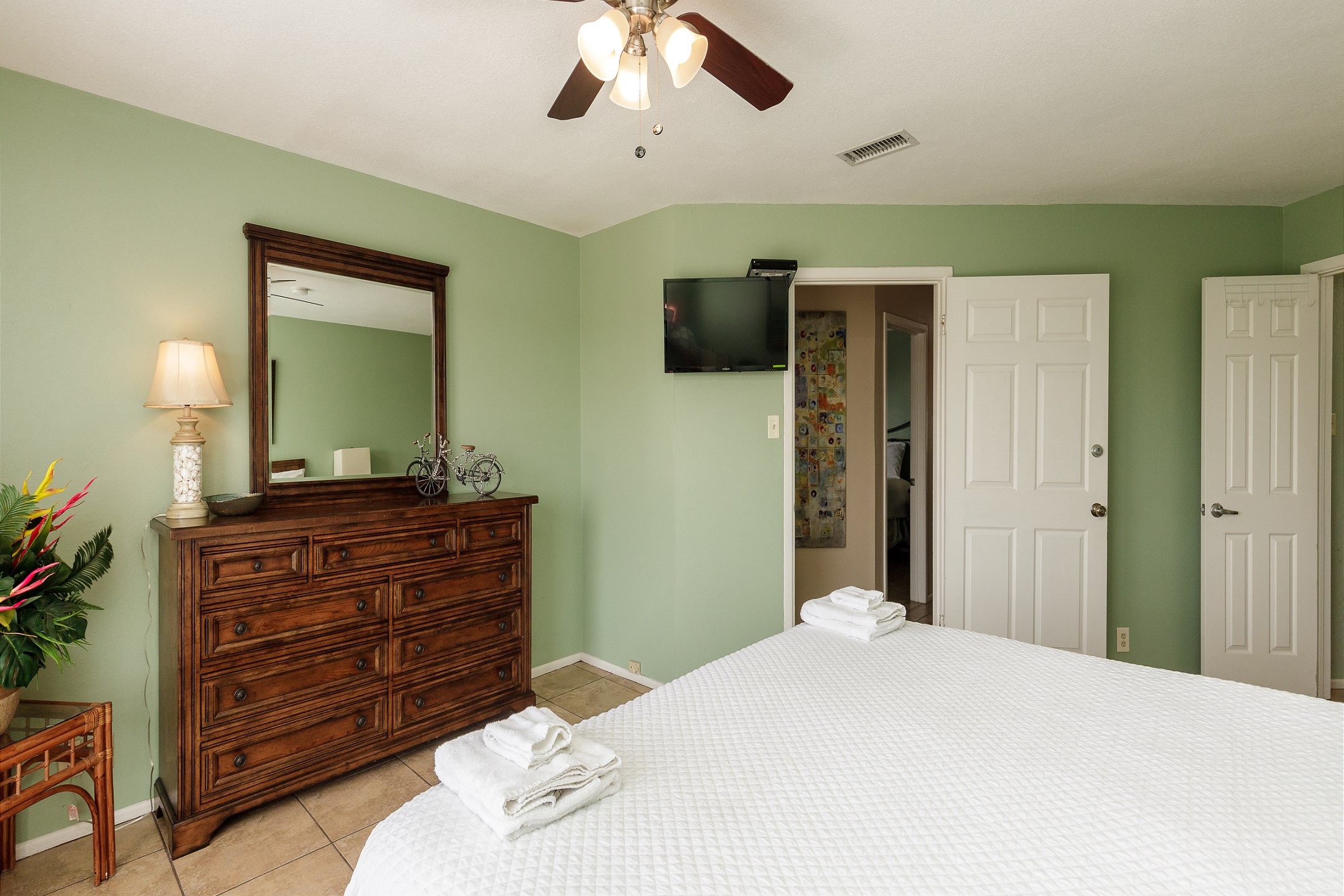 Master bedroom with king size bed, ensuite bathroom and flat screen TV