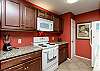 Fully equipped kitchen area with updated appliances 