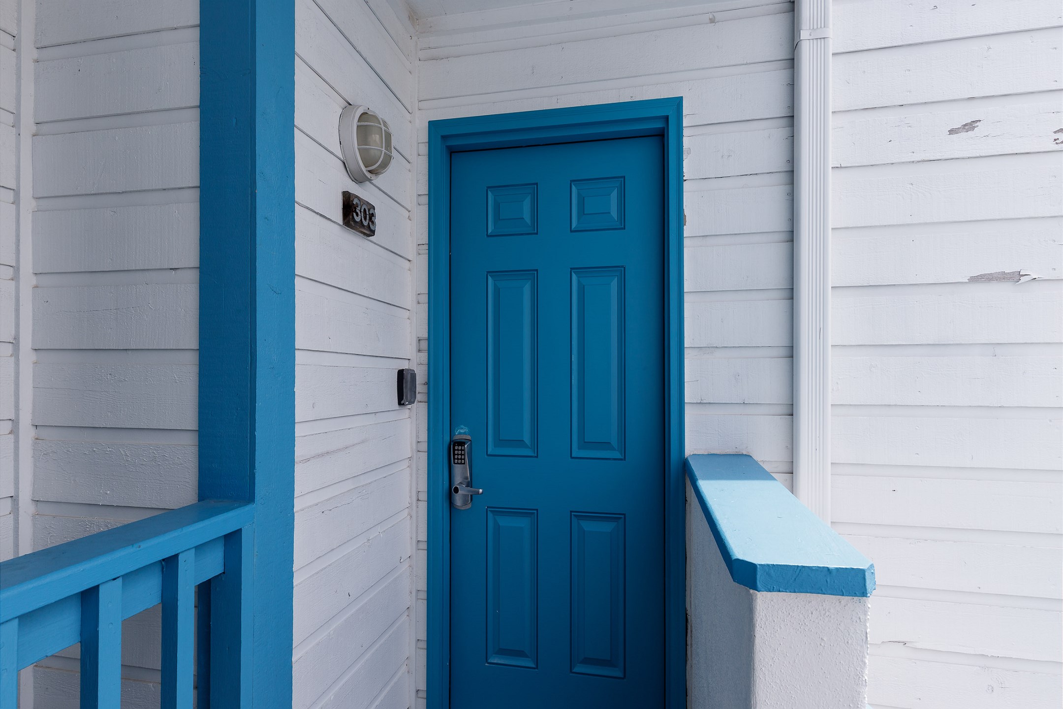 Front door entrance on third floor with coded lock for extra security 